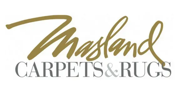 A logo for a company called masland carpets and rugs