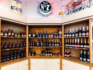 A store filled with lots of bottles of alcohol on shelves.