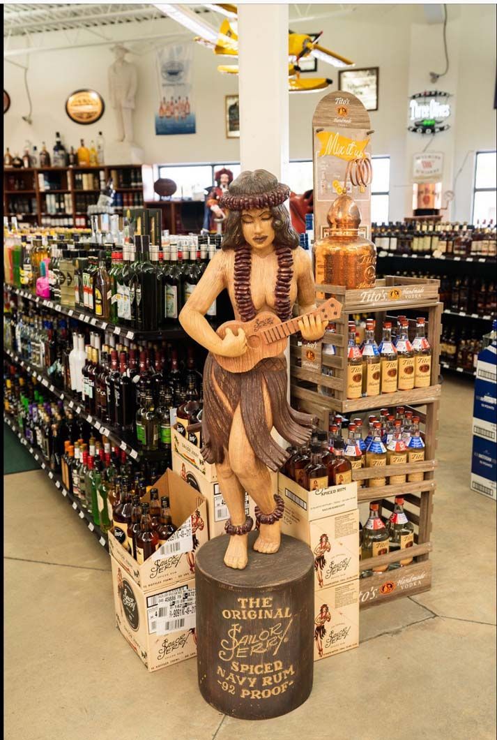 A statue of a woman playing an ukulele in a store