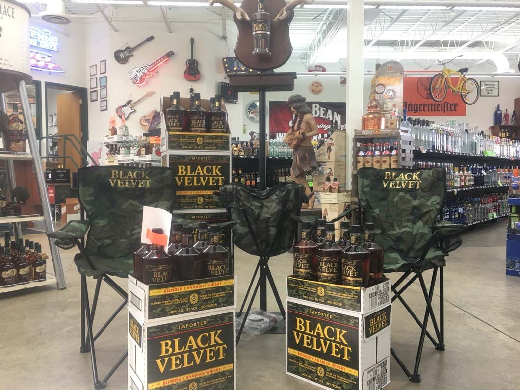 A display of black velvet liquor in a store.