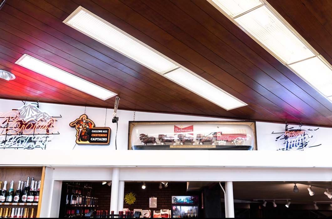 A bar with a sign that says budweiser on it