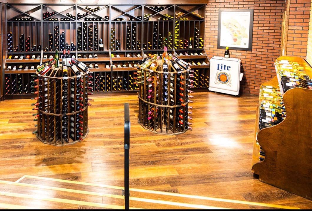 A wine cellar filled with lots of bottles of wine.
