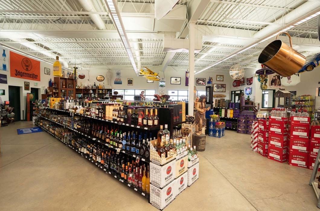 A store filled with lots of shelves and boxes of beer.