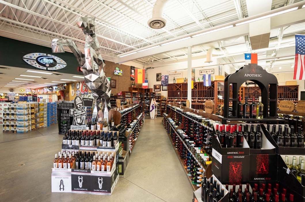 A liquor store filled with lots of bottles of alcohol.