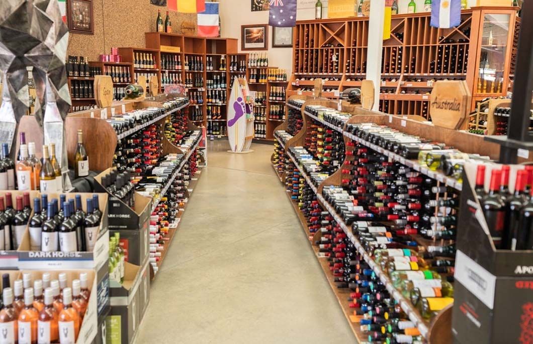 A wine store filled with lots of bottles of wine.