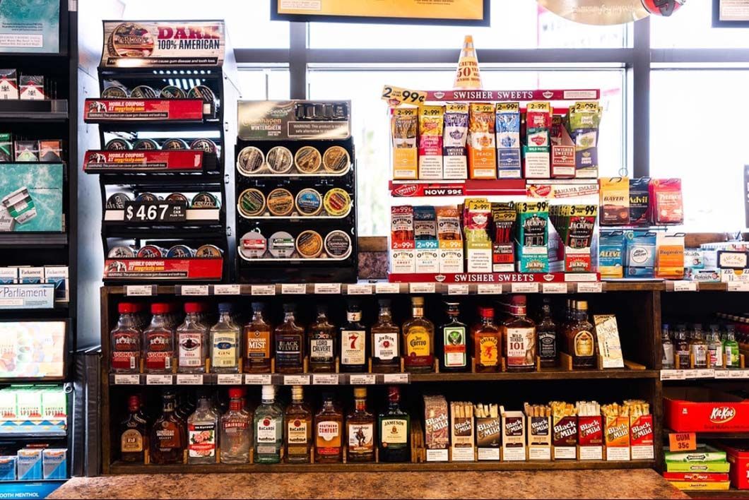 A liquor store filled with lots of alcohol and cigarettes.
