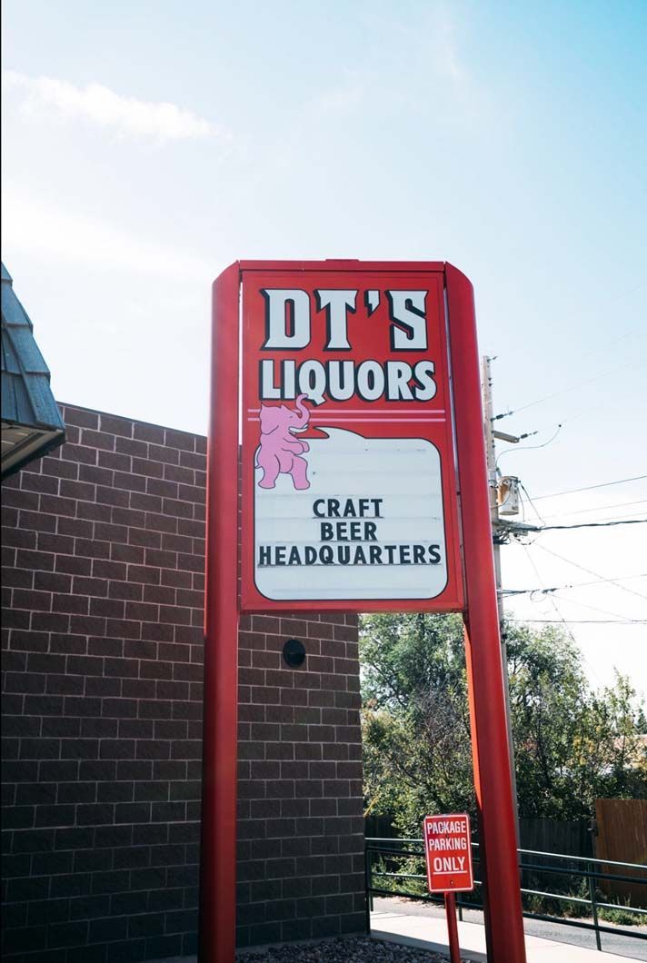 A red sign for dt 's liquors craft beer headquarters
