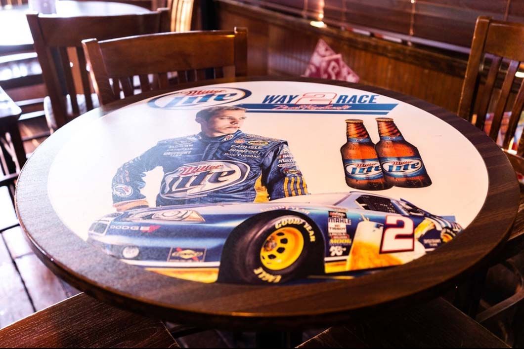 A table with a picture of a race car on it