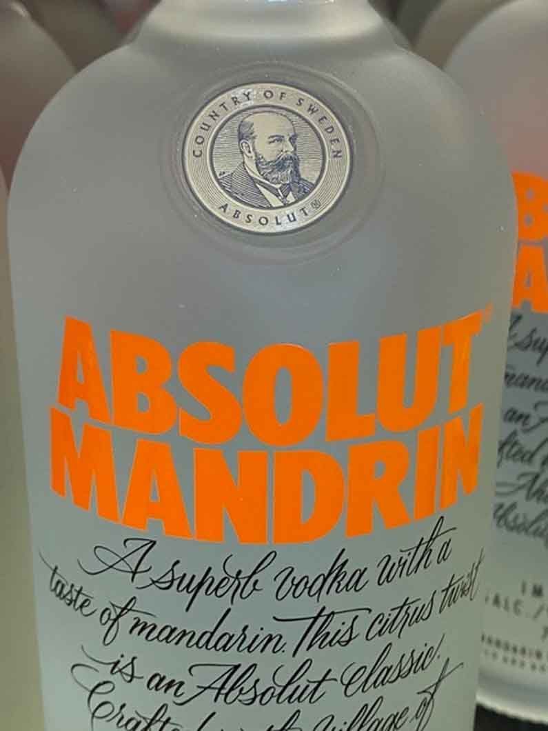 A close up of a bottle of absolut mandarin vodka