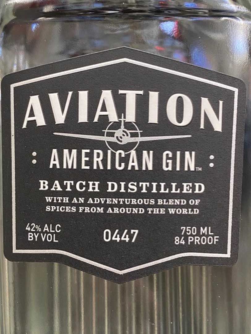 A bottle of aviation american gin batch distilled with an adventurous blend of spices from around the world