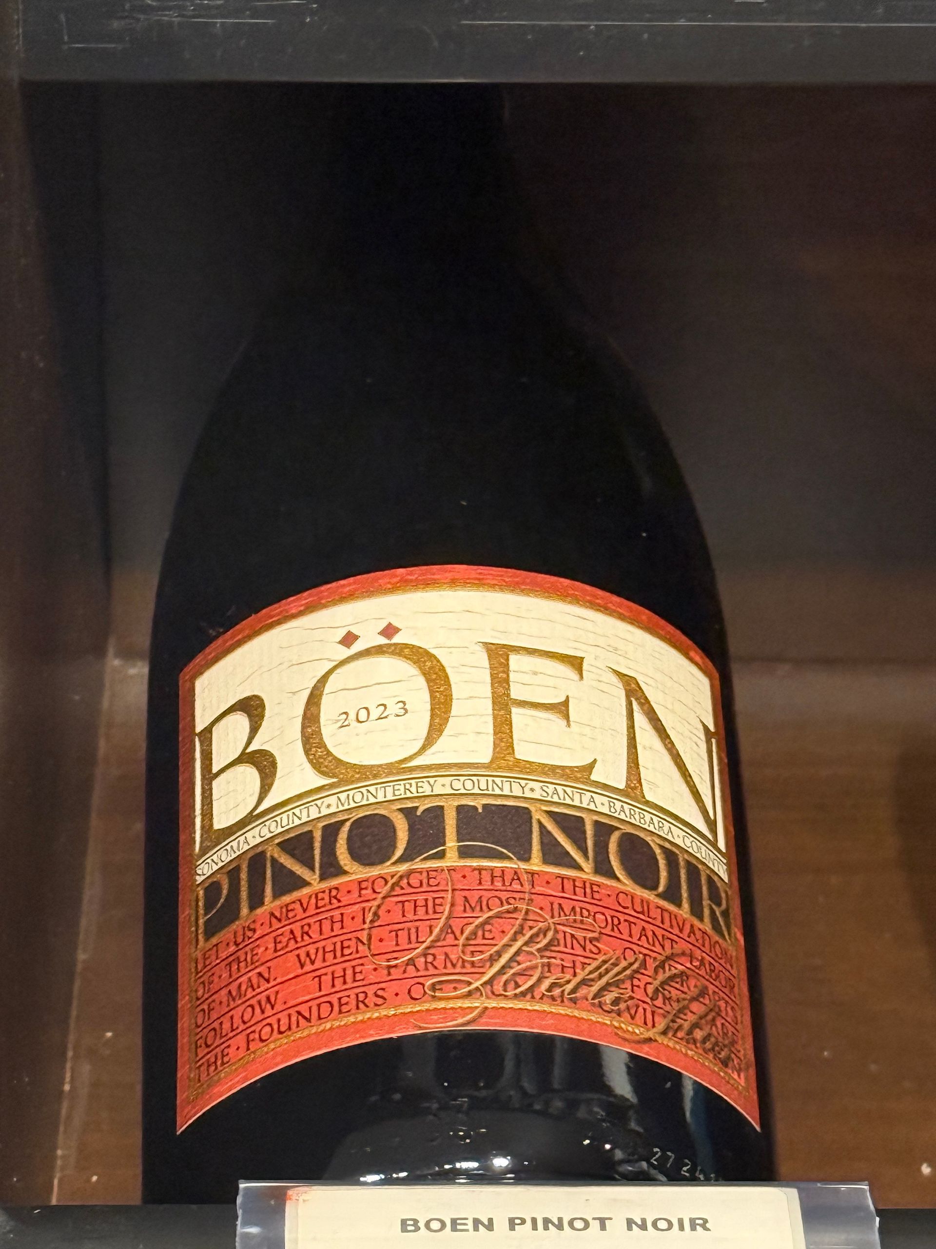 Bottle of Boen Pinot Noir wine. Label is gold, red, and cream.