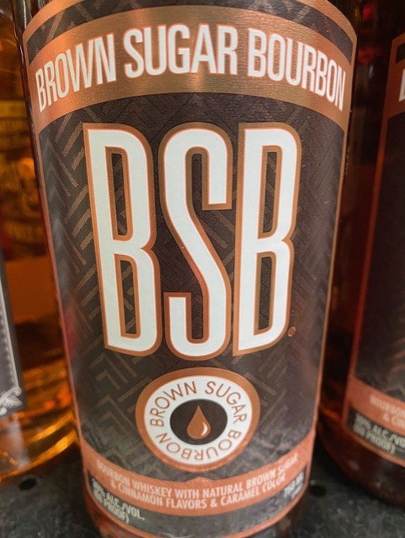 A close up of a bottle of brown sugar bourbon