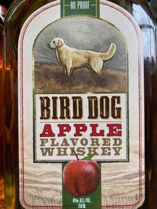 A bottle of bird dog apple flavored whiskey