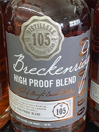A bottle of breckenridge high proof blend whiskey is on a shelf.