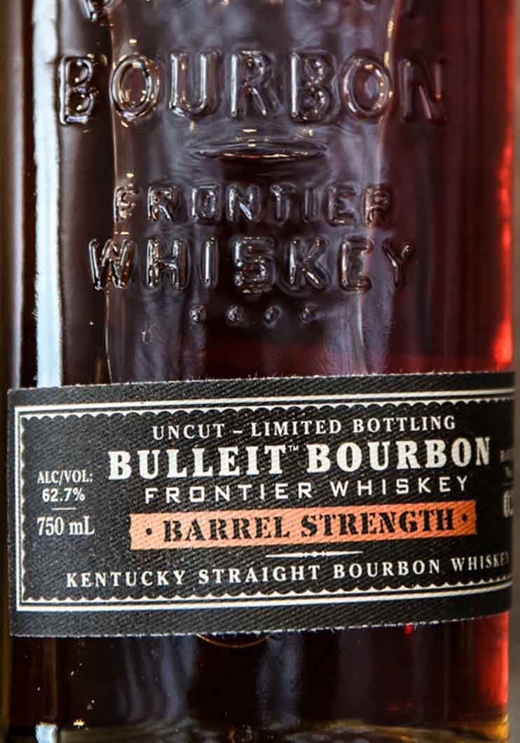 A close up of a bottle of bulleit bourbon frontier whiskey