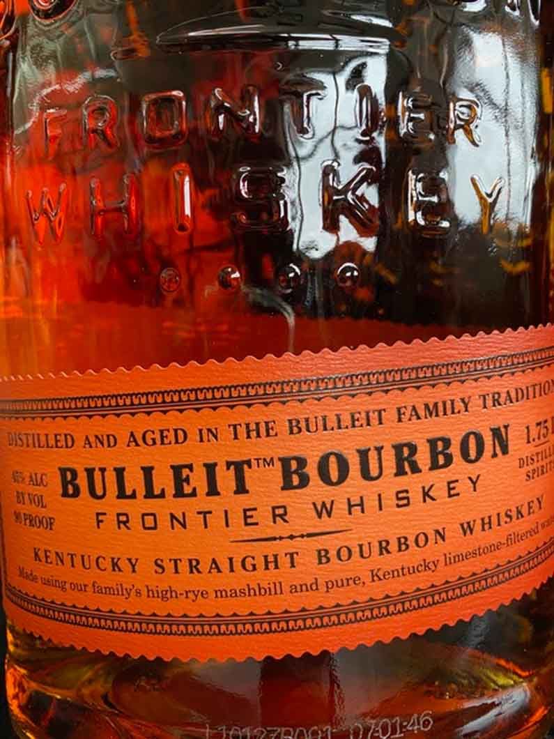A close up of a bottle of bulleit bourbon whiskey