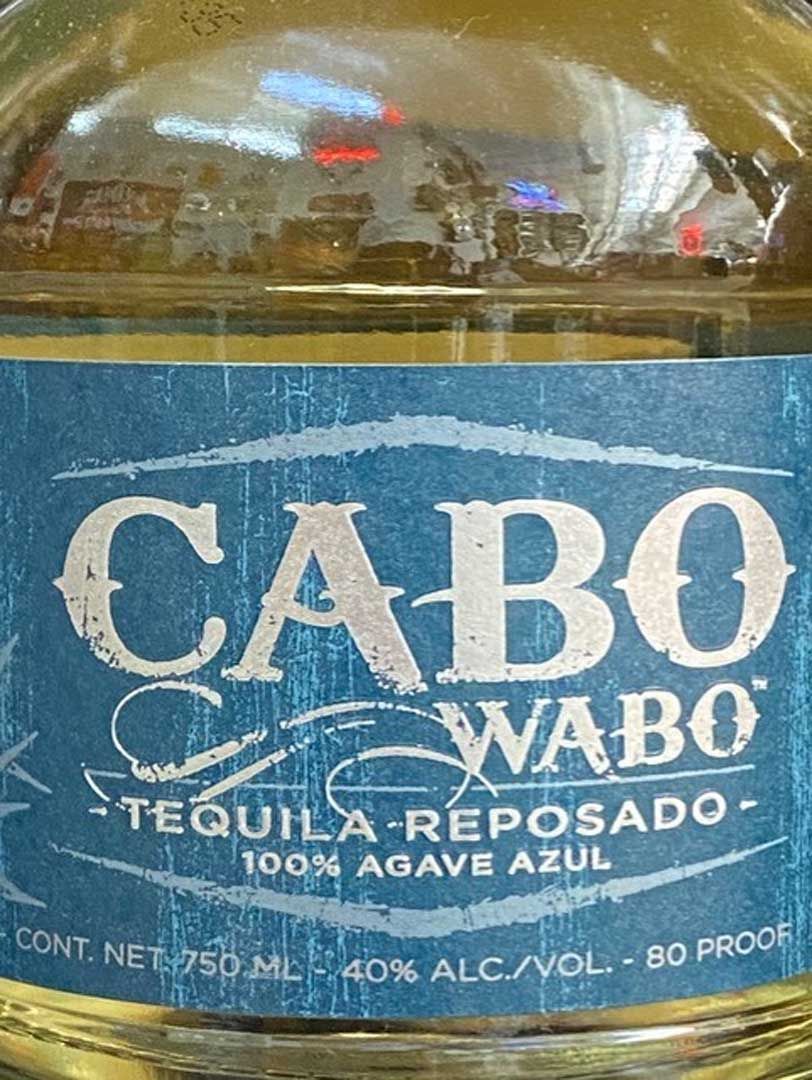 A close up of a bottle of cabo wabo tequila reposado