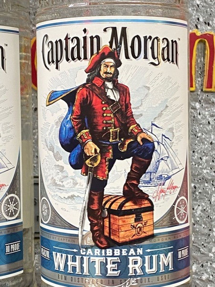 A bottle of captain morgan white rum with a pirate on the label.
