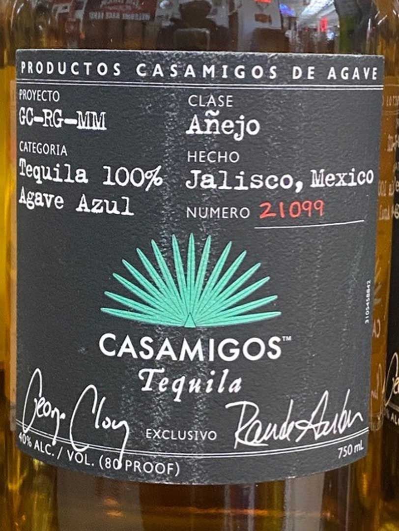 A bottle of casamigos tequila has a black label