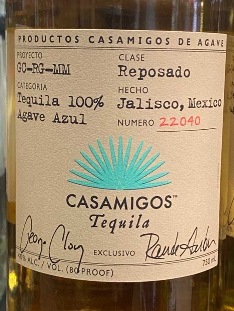 A close up of the label of a bottle of casamigos tequila