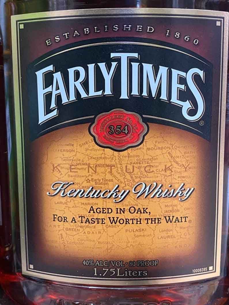 A bottle of early times kentucky whisky aged in oak for a taste worth the wait.