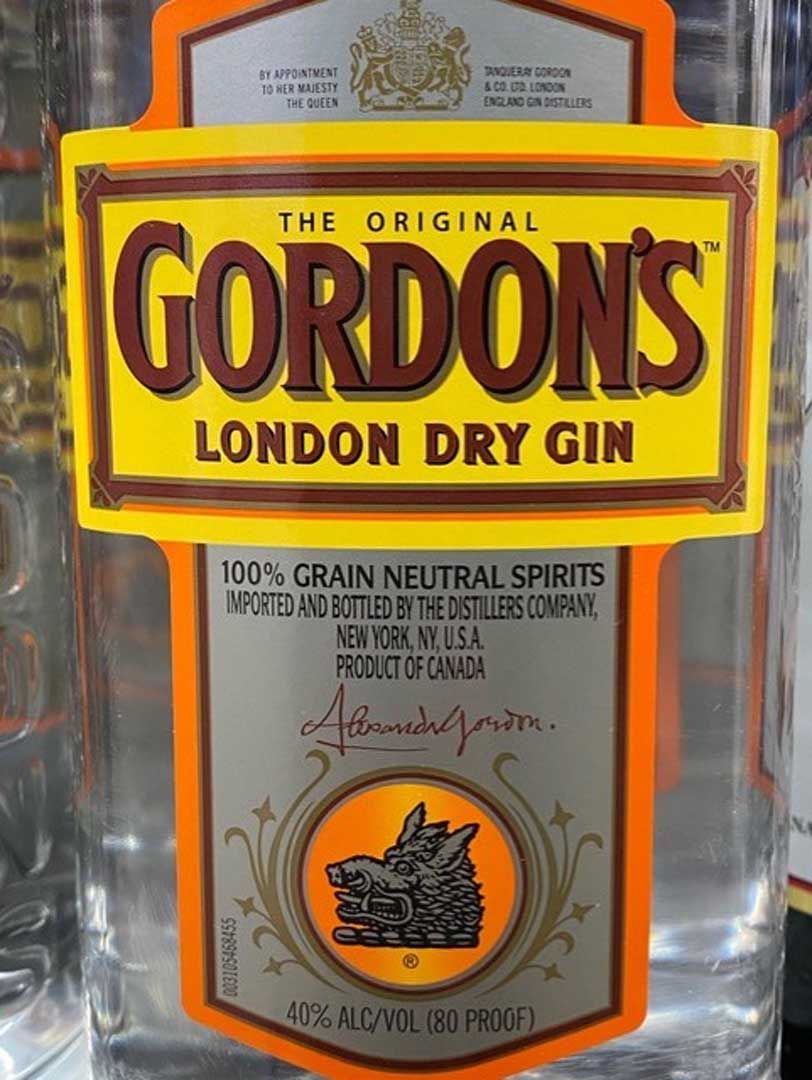 A bottle of gordon 's london dry gin with a wolf on the label