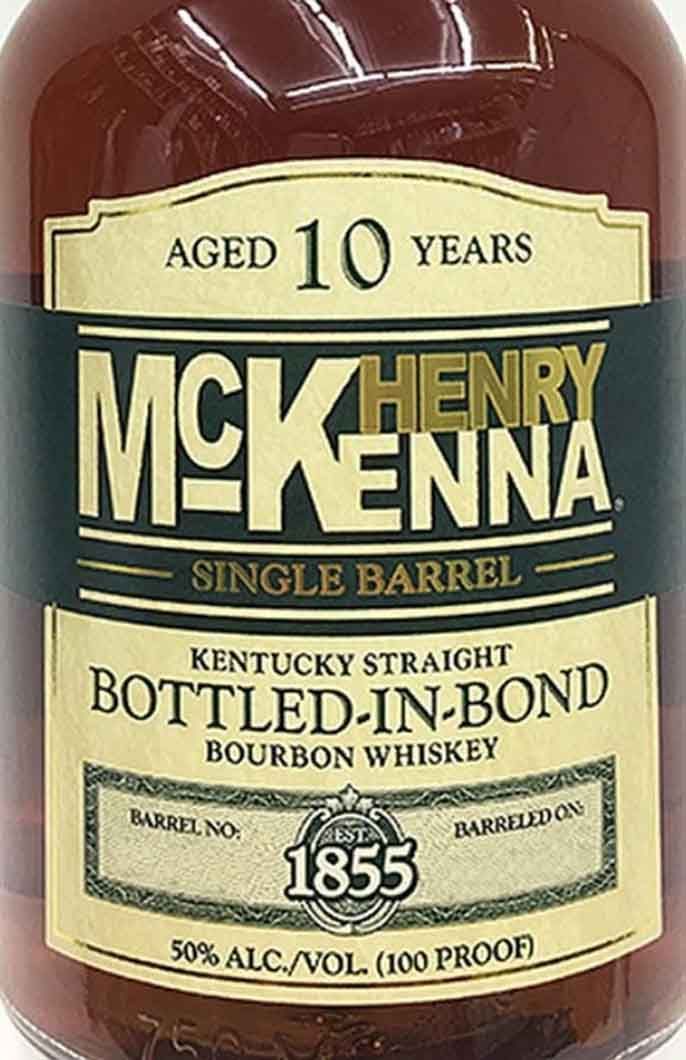 A close up of a bottle of henry mckenna single barrel bottled in bond bourbon whiskey.