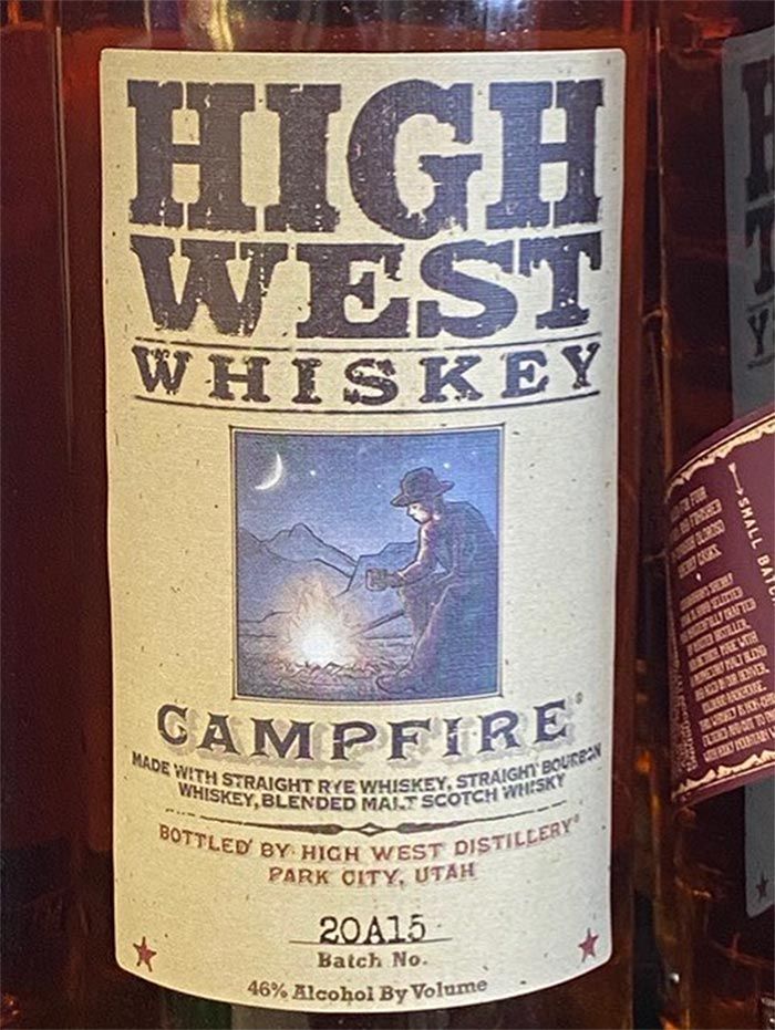 A bottle of high west whiskey has a label that says campfire