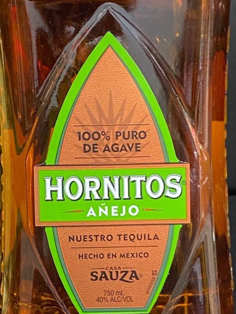 A close up of a bottle of hornitos tequila