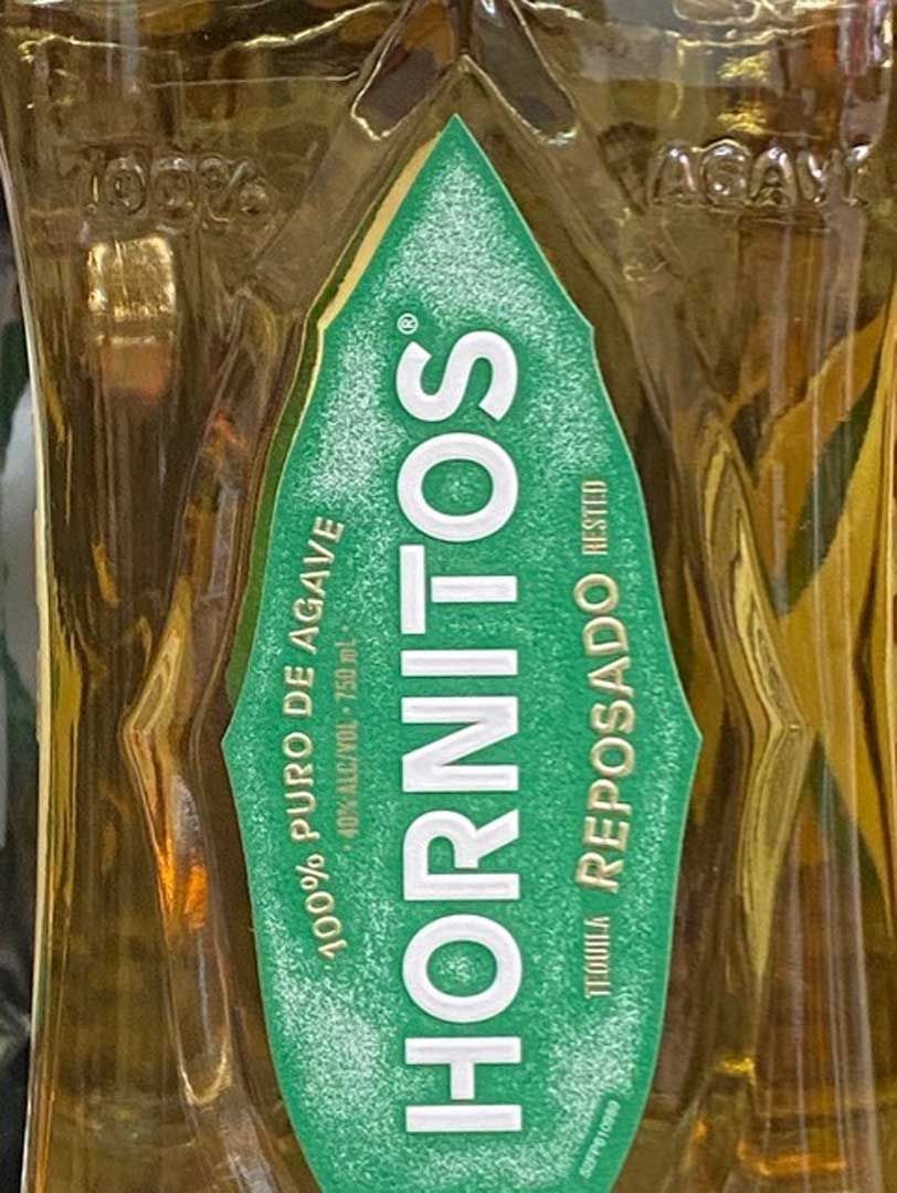 A close up of a bottle of hornitos tequila