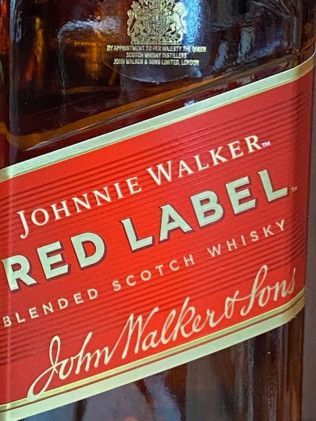 A bottle of johnnie walker red label blended scotch whisky