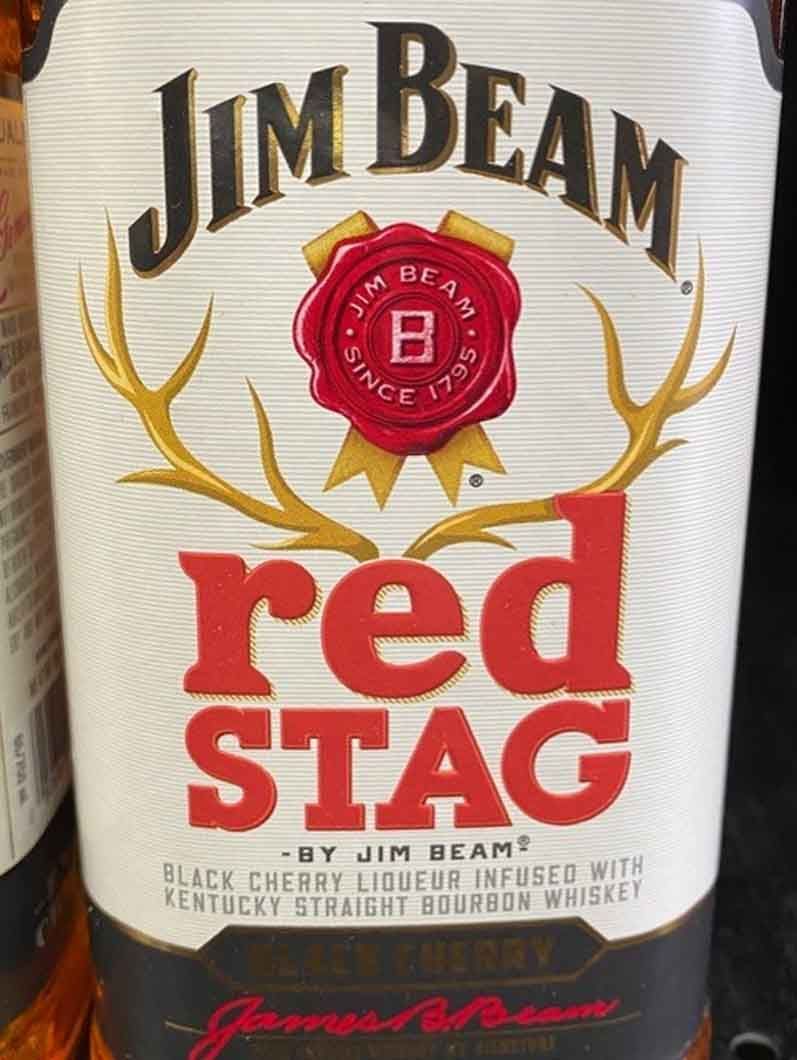 A bottle of jim beam red stag bourbon whiskey