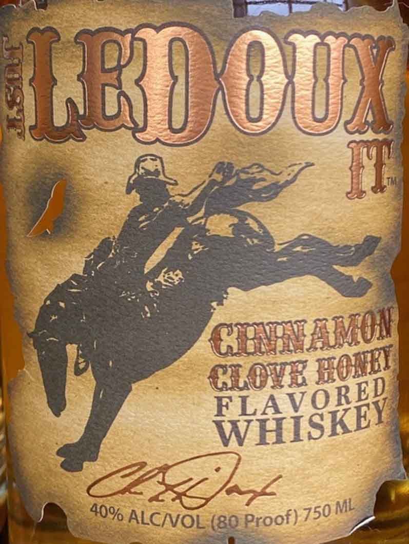 A bottle of ledoux cinnamon clove honey flavored whiskey