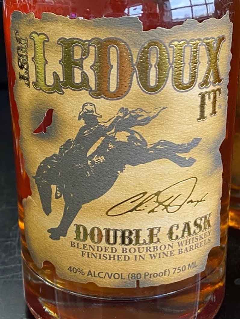 A bottle of ledoux double cask blended bourbon whiskey finished in wine barrels.