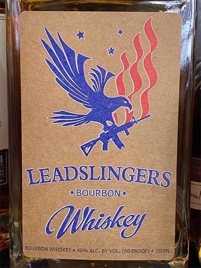 A bottle of leadslingers bourbon whiskey with an eagle on the label