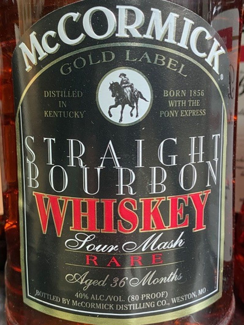 A bottle of mccormick gold label straight bourbon whiskey