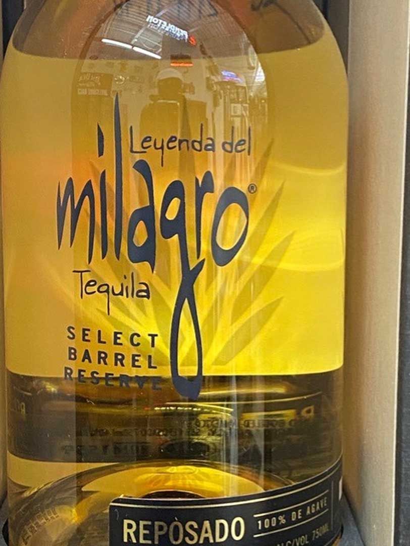A close up of a bottle of milagros tequila