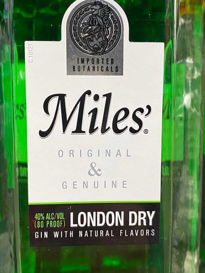 A bottle of miles london dry gin with natural flavors