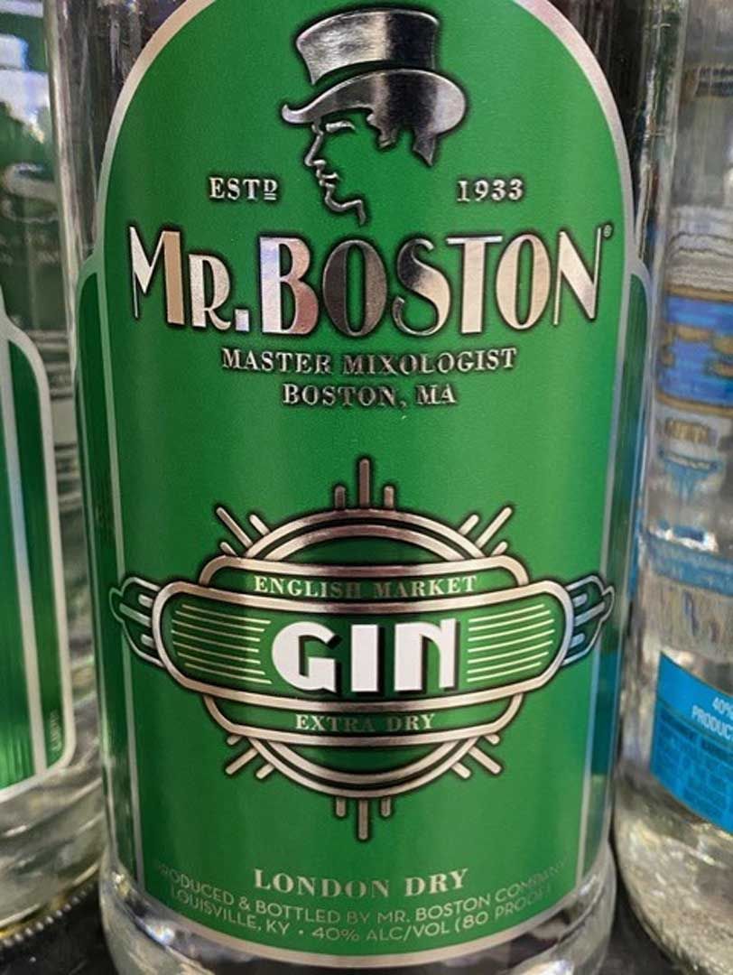 A bottle of mr. boston gin with a green label