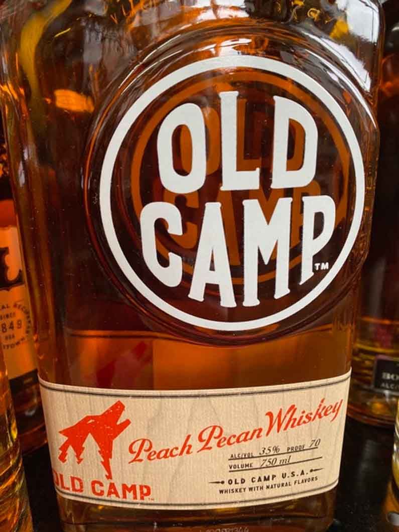 A bottle of old camp peach pecan whiskey