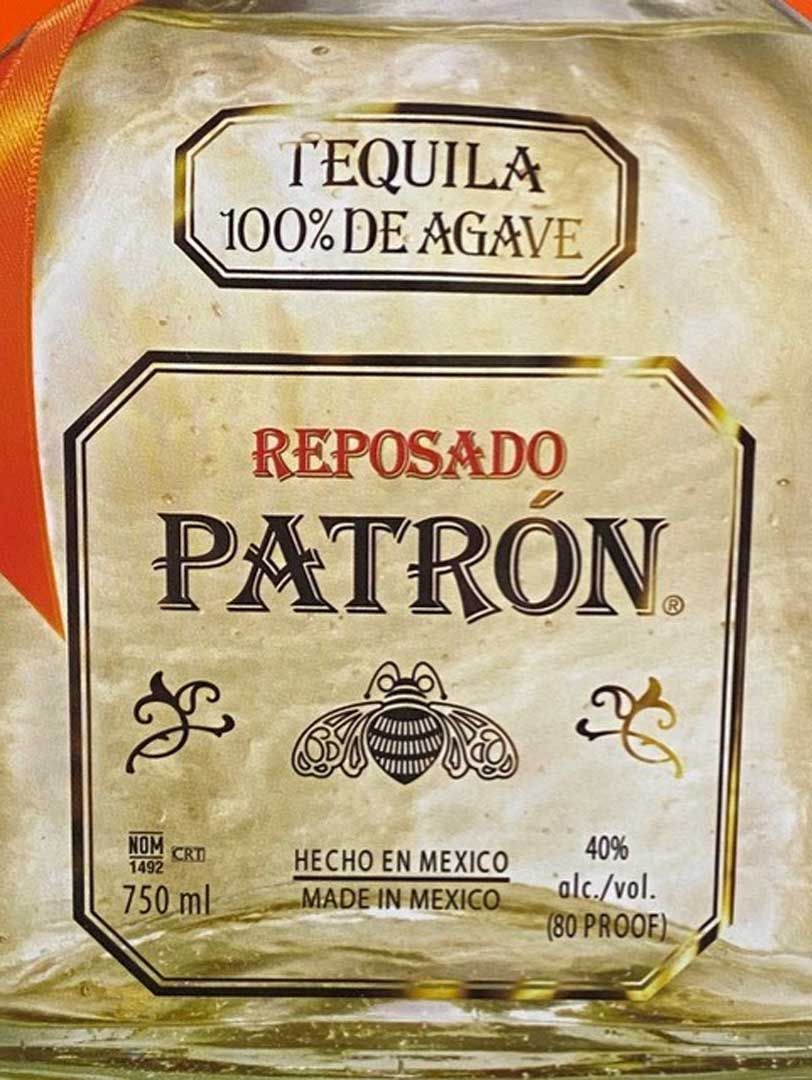 A close up of a bottle of patron tequila