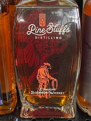 A bottle of pine stuffs distilling straight bourbon whiskey