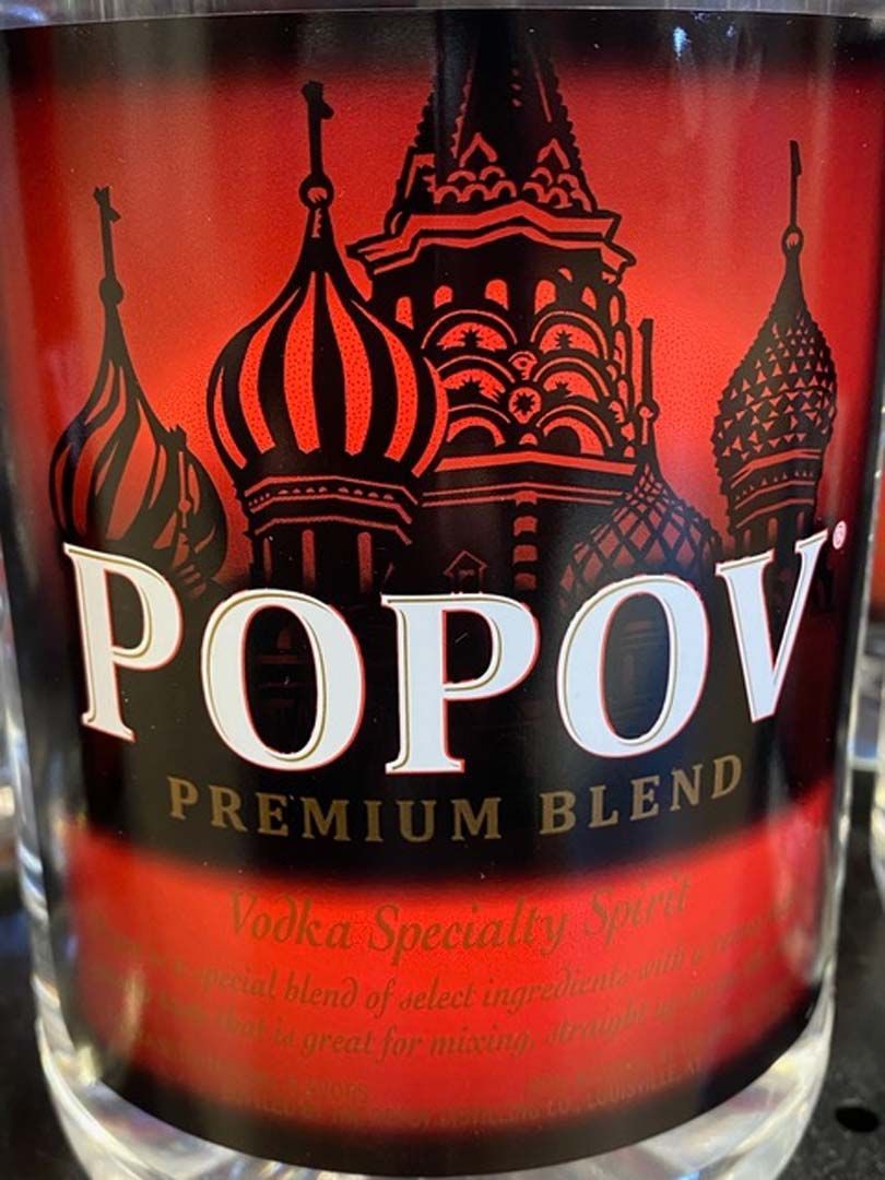 A close up of a bottle of popov premium blend vodka