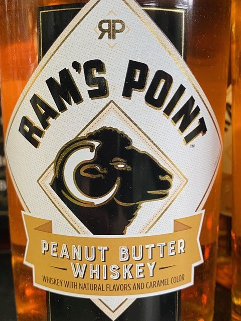 A bottle of ram 's point peanut butter whiskey