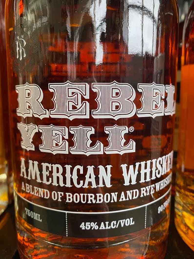 A close up of a bottle of rebel yell american whiskey