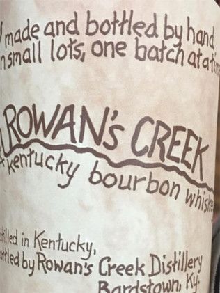 A bottle of rowan 's creek kentucky bourbon whiskey