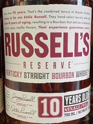 A close up of a bottle of russell 's reserve kentucky straight bourbon whiskey.