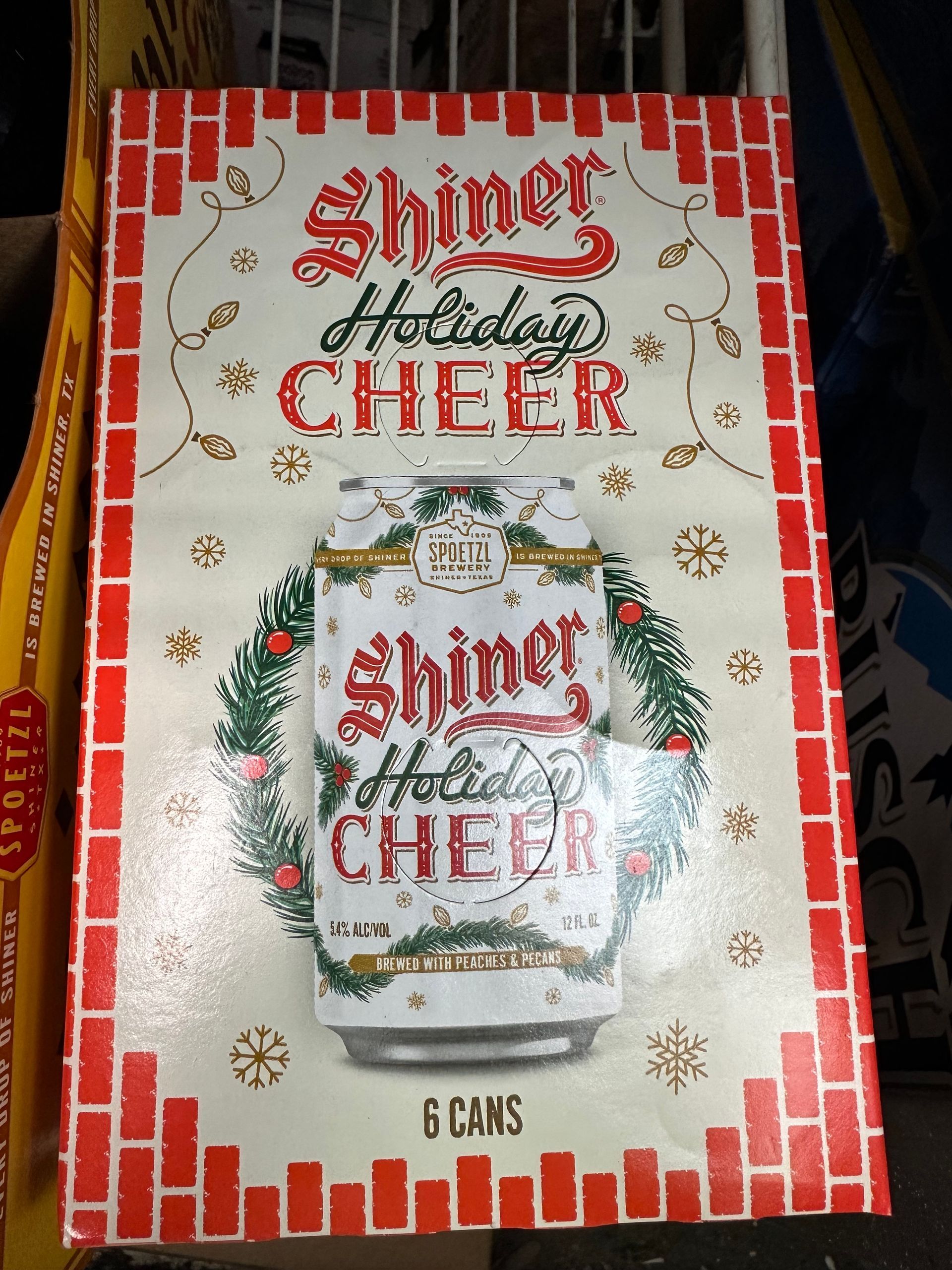 A box of shiner holiday cheer sits on a cart