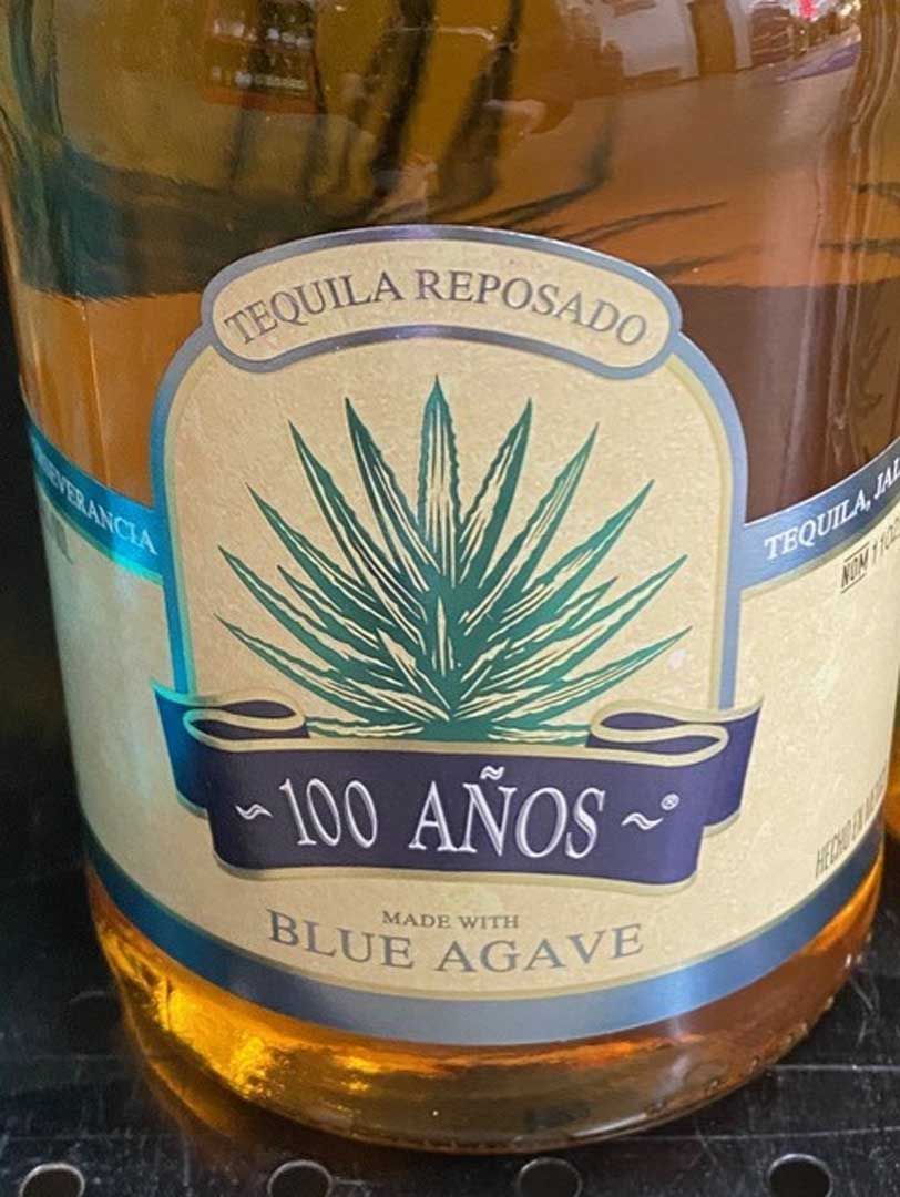 A bottle of tequila reposado made with blue agave