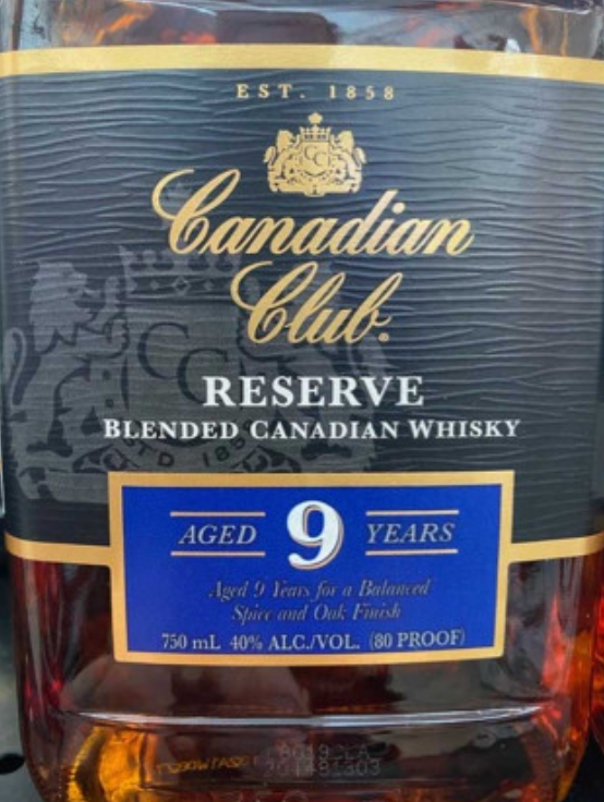 A bottle of canadian club reserve blended canadian whisky